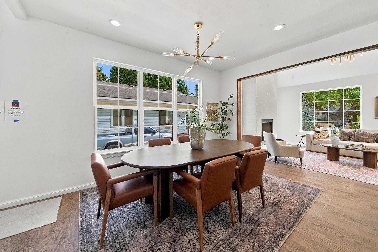 Dining room with leather chairs and chandelier
